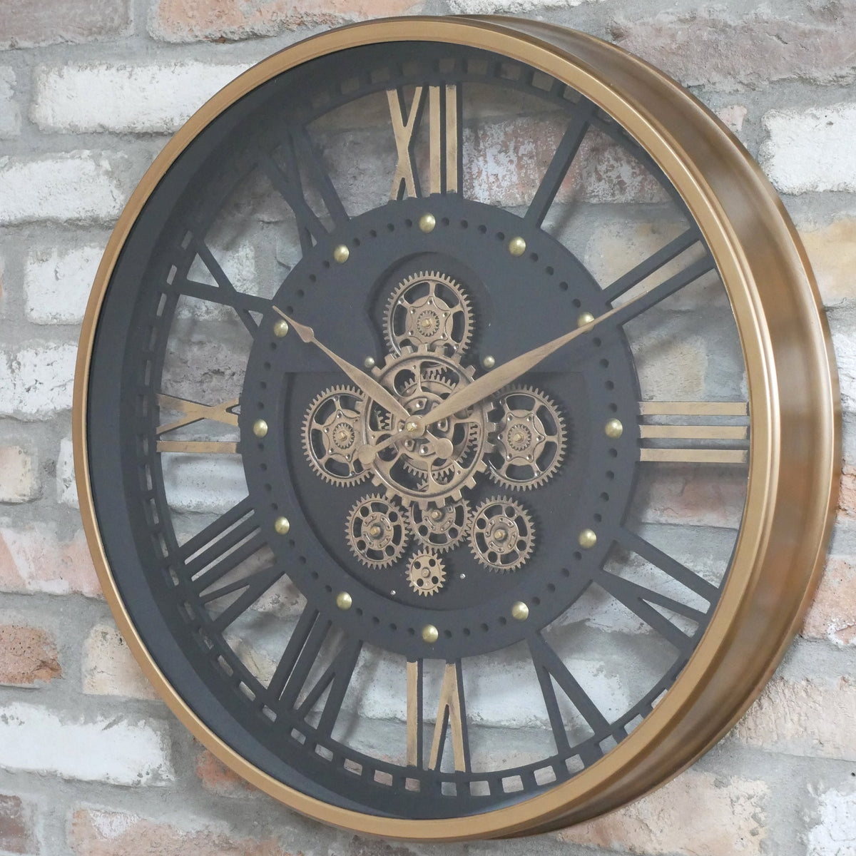 Gold frame skeleton working cog wall clock with black face
