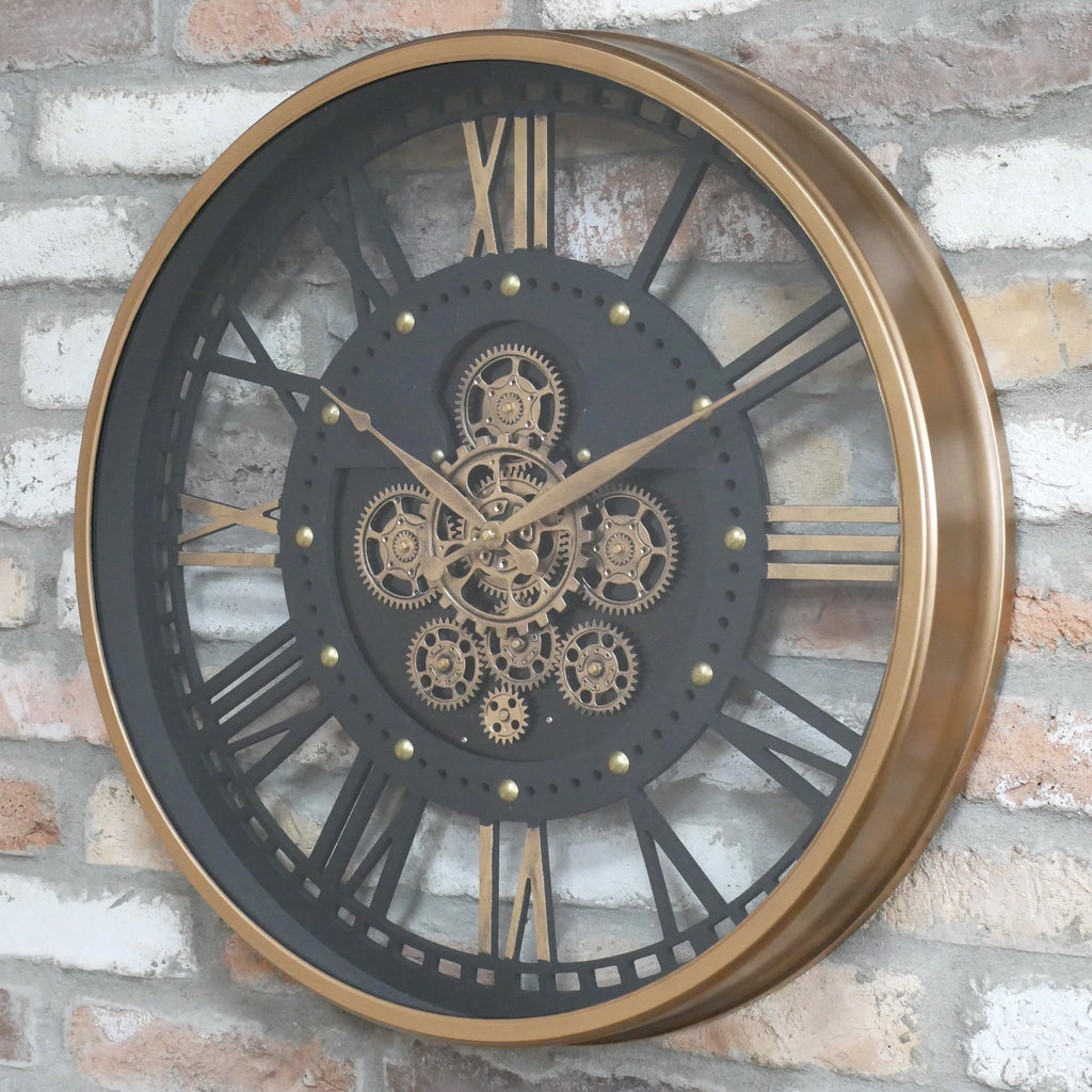 Gold frame skeleton working cog wall clock with black face