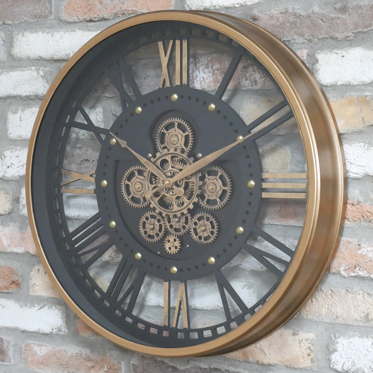 Gold frame skeleton working cog wall clock with black face