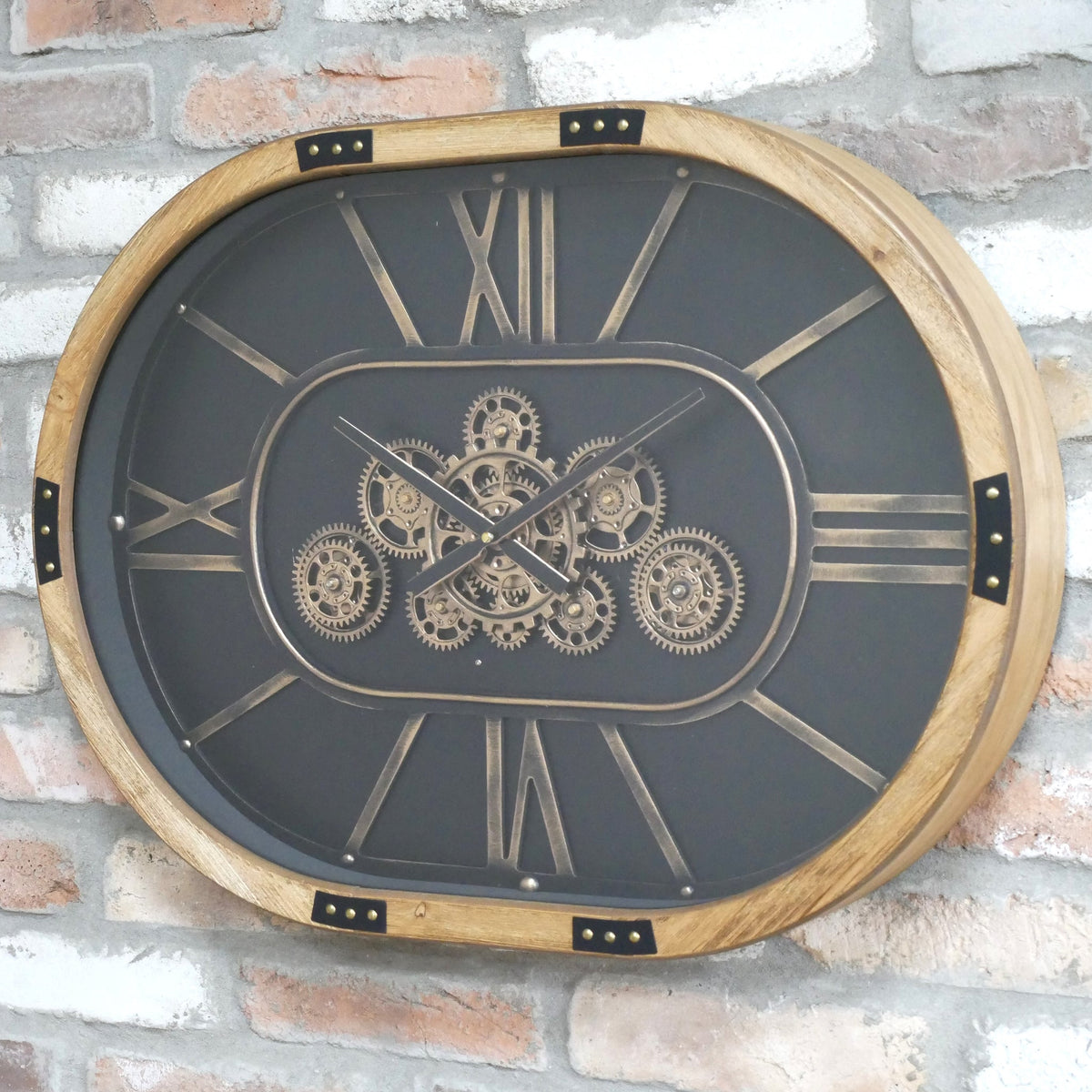 Oval working cog wall clock with black face
