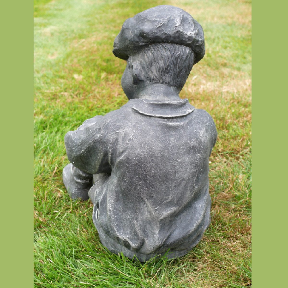 BOY SAT WITH FOOTBALL