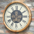 Wood-effect frame working cog wall clock with cream face